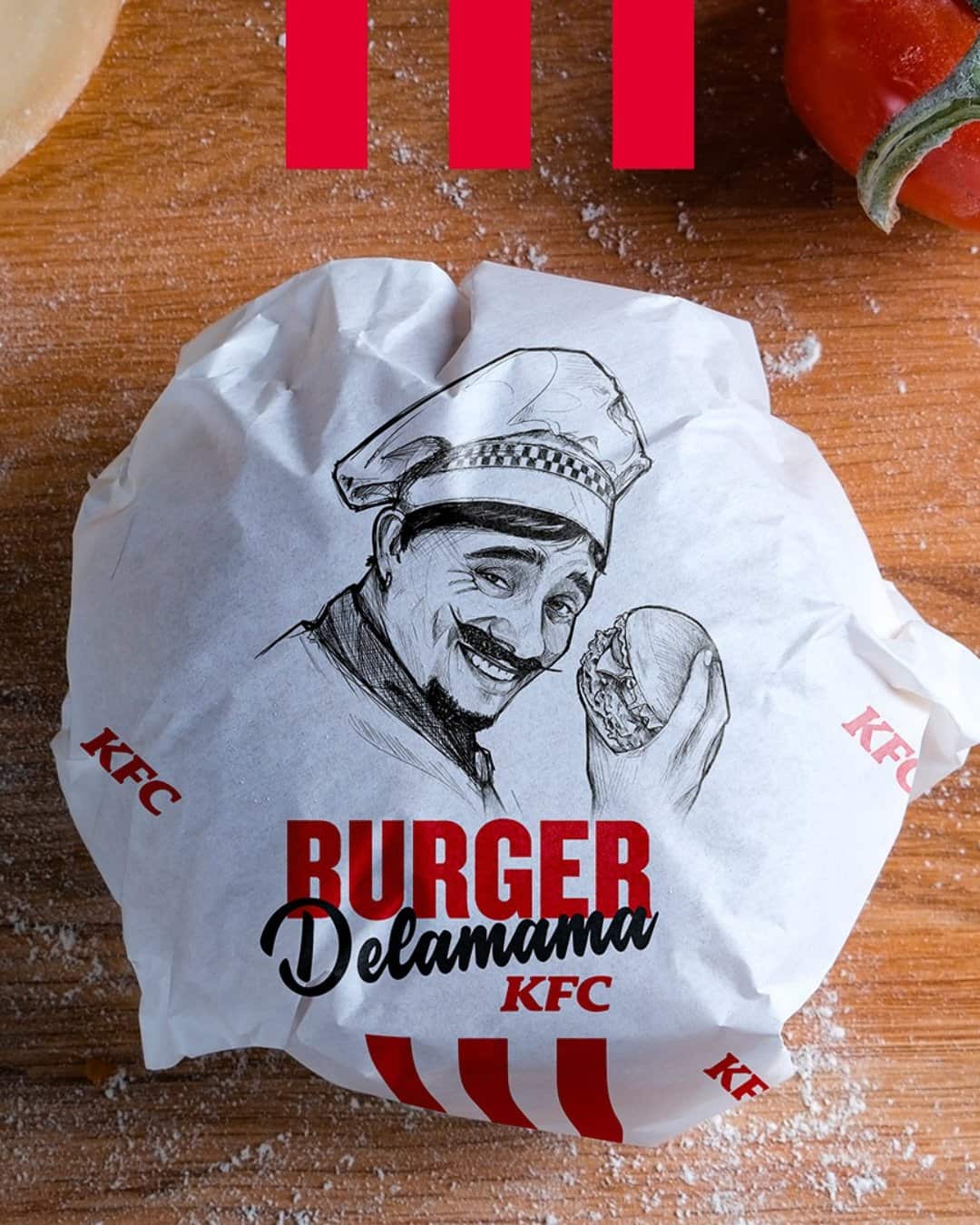 Burger Delamama KFC emballé dans un papier illustré