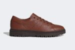 Chaussures Adidas Stan Smith Freizeit marron, collection 2024, avec une tige en cuir tumblé et semelle en caoutchouc robuste.